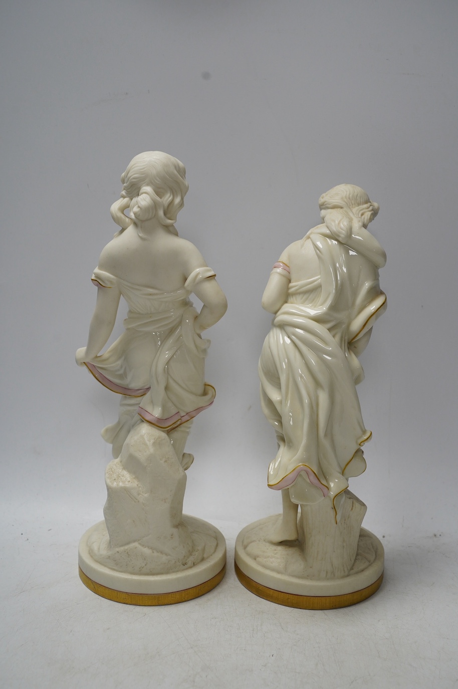 A pair of Worcester partially glazed figurines, 29cm high. Condition - good